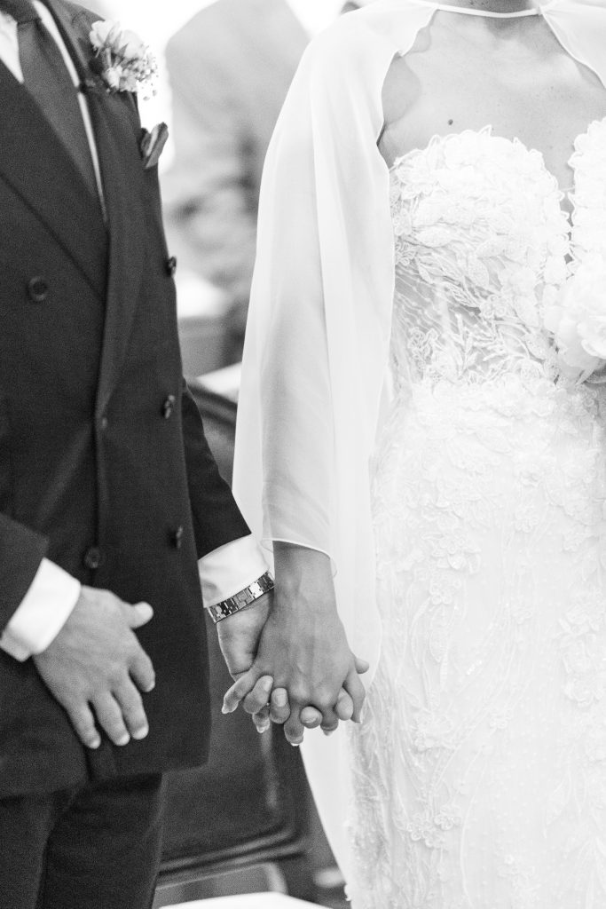 a bride and groom holding hands