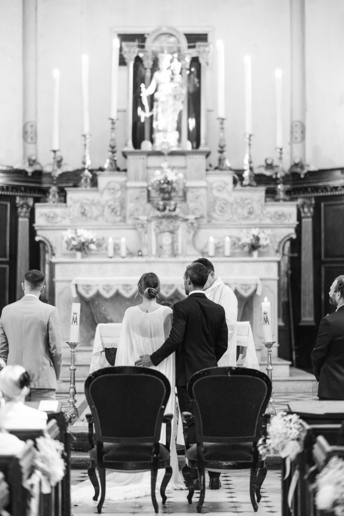 a group of people standing in a church